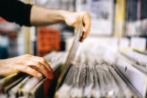 Record store, second hand vinyl records, hands searching