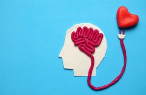 Figure of man with brain and red heart. Love and intelligence